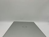 an open laptop computer sitting on top of a white table