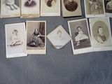 a lot of old photos of people on the table