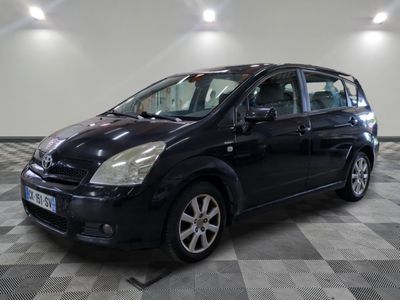 a picture of a black car parked in a garage