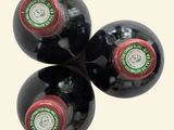 three bottles of wine sitting next to each other on a table