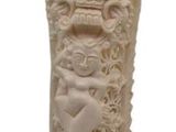 a white vase that has been made out of wood