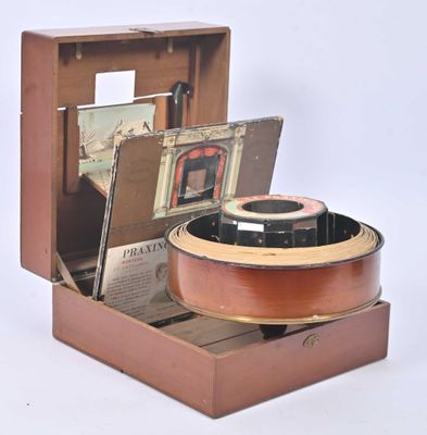 a small wooden box with a guitar inside of it
