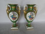 two vases that have been painted with flowers on them