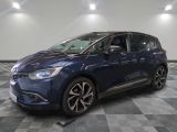 a blue car is parked in a room with a checkered floor