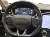 a steering wheel and dashboard of a car with a touch screen