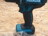 a cordless drill that is sitting on top of a piece of plywood