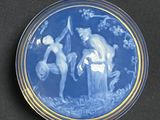 a blue plate with a picture of a man and a woman on it