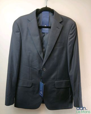 a picture of a suit hanging on a hanger