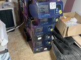 a pile of boxes sitting on the floor next to a radiator