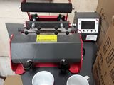 a machine that is sitting on a table with two cups on it