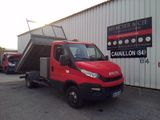a red truck that is parked in front of a building