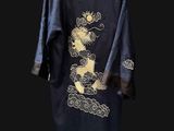 an image of a black robe with a gold dragon on it