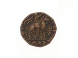 an old bronze coin with a man and a bird on it