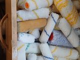 a wooden box filled with towels and a wooden spoon