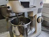 a mixer that is sitting on a counter in a kitchen