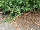 a fence that has some plants growing out of it