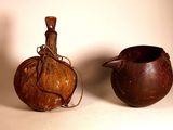 two brown vases sitting next to each other on a table