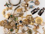 a pile of jewelry that is laying on a table