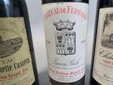 three bottles of wine that are sitting on a table