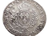 a close up of a coin with a crown on it