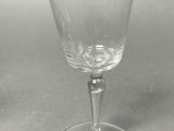 a wine glass that is sitting on a table