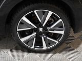 a close up view of a car ' s wheel on the floor