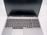 an open laptop computer sitting on top of a white table