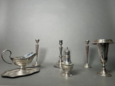 three silver objects sitting on a table next to each other