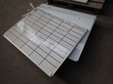 a piece of paper sitting on the floor next to a pallet
