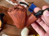 a person that is holding a pipe in their hand