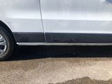 a white van parked on the side of the road