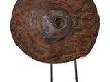 a large wooden object with a metal stand on a white background