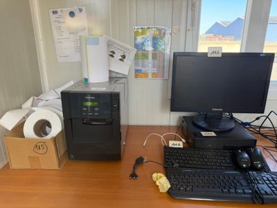 a desktop computer sitting on a desk next to a computer monitor