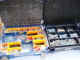 a tool box with many different types of screws in it