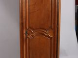 an image of a wooden cabinet with a door on top of it
