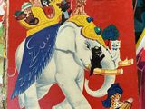 a book with a picture of an elephant riding on top of it