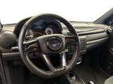 a steering wheel and dashboard of a small car