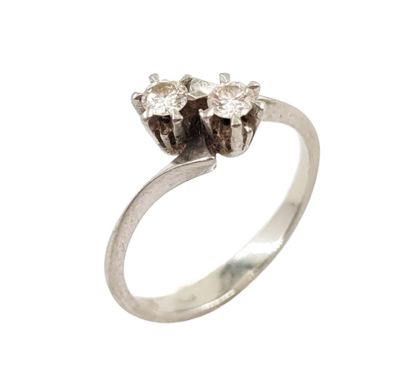 a close up of a diamond ring on a white background