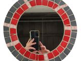 someone is taking a picture of themselves in a mirror with a cell phone