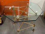 a glass table with a metal frame and a glass top