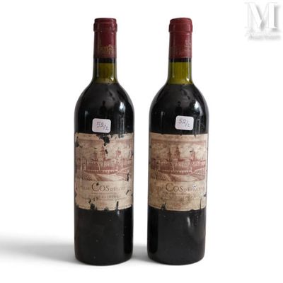 two bottles of wine sitting next to each other on a white surface