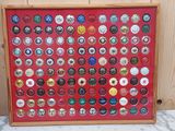 a picture of a picture of a display of beer bottle caps
