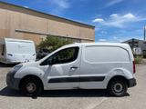a white van that is parked in a parking lot