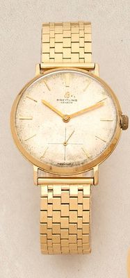 an image of a close up of a wrist watch on a table