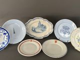 a lot of plates that are sitting on a table
