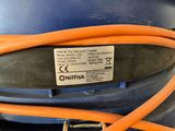 a close up of an orange hose connected to a blue container