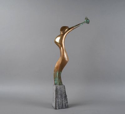 a bronze sculpture of a woman holding a flower in her hand