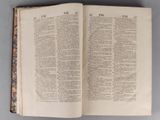 an open book on a table with a page of text on it