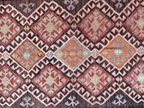 a close up of a rug on a wooden floor