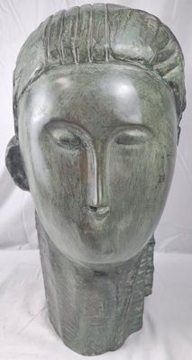 sculpture of a woman ' s head on a white background
